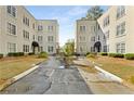 An exterior view of two apartment buildings and shared parking at 30 Collier Nw Rd # 6, Atlanta, GA 30309