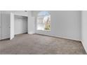 A bright bedroom with a large arched window and walk-in closet provides lots of natural light at 360 Wembley Cir, Atlanta, GA 30328