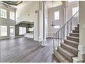 Spacious living room featuring large windows, hardwood floors, and an open floor plan at 360 Wembley Cir, Atlanta, GA 30328