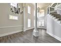 Elegant living room featuring hardwood floors, soaring ceilings, and a grand staircase at 360 Wembley Cir, Atlanta, GA 30328