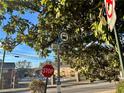 A street view with a bus stop sign and a stop sign visible at 3698 Fairlane Nw Dr, Atlanta, GA 30331