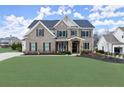 Attractive two-story brick home with shutters, stone entryway, and well-kept landscaping at 2903 Eva Clb, Acworth, GA 30101