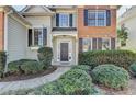 Charming two-story home featuring brick and siding exterior, well-manicured landscaping, and inviting front entrance at 3202 Monarch Pine Dr, Peachtree Corners, GA 30071