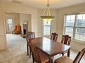 Inviting dining room featuring a classic chandelier, and access to an adjoining space at 3885 Laurens Ln, Snellville, GA 30039