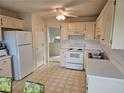 Functional kitchen featuring white cabinets and appliances at 3885 Laurens Ln, Snellville, GA 30039