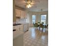 Bright eat-in kitchen with ceiling fan, tile floor and white appliances at 3885 Laurens Ln, Snellville, GA 30039