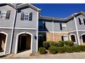 Lovely townhouse with well-maintained exterior and manicured green shrubbery at 506 Summer Pl, Norcross, GA 30071