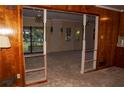 Open floor plan showcasing the living room, viewed from the wood-paneled kitchen at 3204 Spreading Oak Sw Dr, Atlanta, GA 30311