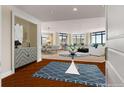 Bright and airy living room with modern decor, large windows, and dark wood flooring at 750 Park Ne Ave # 25W, Atlanta, GA 30326