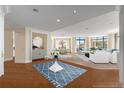 Spacious living room with large windows, white sofas, and an adjacent dining area at 750 Park Ne Ave # 25W, Atlanta, GA 30326