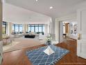 Expansive living room with elegant furnishings, large windows, and views of the city at 750 Park Ne Ave # 25W, Atlanta, GA 30326