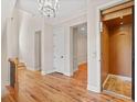 Bright foyer with hardwood floors, chandelier, and an elevator for easy access to all levels at 130 Staddlebridge Ave, Canton, GA 30114