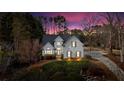 Beautiful home with a classic facade, surrounded by trees and a long driveway with basketball hoop at 5382 Whitaker Nw Trl, Acworth, GA 30101