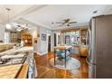 Open kitchen with granite countertops, stainless steel appliances, and a central island at 698 Bellemeade Nw Ave, Atlanta, GA 30318