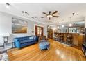 Bright and airy living room featuring hardwood floors and a bar area, perfect for entertaining at 698 Bellemeade Nw Ave, Atlanta, GA 30318