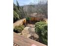 Aerial view of a backyard space featuring a wooden fence and landscaped area at 201 Balaban Cir, Woodstock, GA 30188