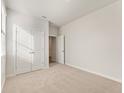 Comfortable bedroom with neutral carpet, a double door closet, and natural light from a window at 4155 Viola Pl, Atlanta, GA 30349