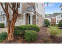 Charming brick townhouse featuring a covered entryway and attached one car garage at 6080 Indian Wood Se Cir, Mableton, GA 30126