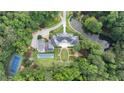 Aerial view of estate featuring a pool, tennis court, and landscaped grounds at 4615 Northside Dr, Atlanta, GA 30327