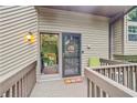 Welcoming front porch with a cozy entrance featuring a decorated front door at 3625 N Berkeley Lake Nw Rd, Berkeley Lake, GA 30096