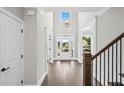 Foyer showcasing high ceilings, a chandelier, and hardwood floors at 3790 Chattahoochee Rd, Cumming, GA 30041