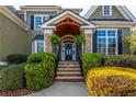 Charming front porch with stone accents, manicured bushes, and a welcoming entrance at 3963 Hazelhurst Lake Dr, Marietta, GA 30066