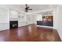 Open-concept living room with fireplace and mosaic bar top that connects to kitchen at 556 Moreland Ne Ave # J, Atlanta, GA 30307