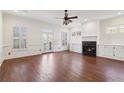 Bright living room with hardwood floors, fireplace, and access to a private balcony at 556 Moreland Ne Ave # J, Atlanta, GA 30307