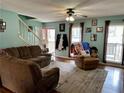 Inviting living room offering comfortable seating, views to front yard, and stairs to upper level at 1536 Hunters Cv, Auburn, GA 30011