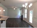 Open living room with hardwood floors, fireplace, ceiling fan and lots of natural light at 680 Sundial Ln, Mableton, GA 30126