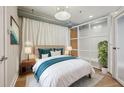 Cozy bedroom with soft lighting, neutral tones, and a stylish glass partition at 1029 Piedmont Ne Ave # 101, Atlanta, GA 30309