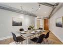 Modern dining room featuring stylish lighting and a large table perfect for entertaining at 1029 Piedmont Ne Ave # 101, Atlanta, GA 30309