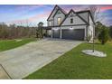 Charming two-story home with a well-maintained lawn and spacious driveway at 372 Garnet Dr, Acworth, GA 30101