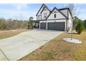 Charming two-story home featuring a two-car garage and well-manicured lawn at 372 Garnet Dr, Acworth, GA 30101