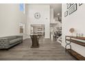 Spacious living room with high ceilings, modern decor, and beautiful hardwood floors at 372 Garnet Dr, Acworth, GA 30101