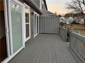 Spacious gray back deck perfect for outdoor entertaining, with sliding glass doors at 504 Harbor Lake Ct, Marietta, GA 30066