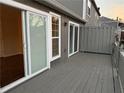 Wide sliding glass doors access a wooden back deck offering great natural light at 504 Harbor Lake Ct, Marietta, GA 30066