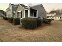 Well-maintained exterior view of home, featuring manicured shrubs and a tidy lawn at 504 Harbor Lake Ct, Marietta, GA 30066