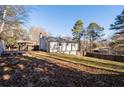 Expansive backyard with a wooden deck, offering ample space for outdoor activities and relaxation at 2571 Hamill Dr, Buford, GA 30519