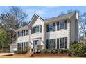 Classic home with black shutters, complemented by mature landscaping and brick accents at 2999 Timberlea Lake Se Way, Marietta, GA 30067