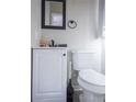 Neat bathroom featuring a modern vanity with a black faucet, alongside a clean toilet at 3490 Primrose Pl, Decatur, GA 30032