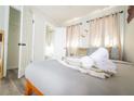 Inviting bedroom featuring a comfortable bed and doorway to the attached bathroom at 3490 Primrose Pl, Decatur, GA 30032
