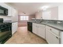 Open kitchen with modern appliances and a view into the adjoining living area at 493 Townsend Bnd, Stockbridge, GA 30281