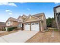 Two-story home with a two-car garage and long driveway at 5480 Beaver Ridge Dr, Cumming, GA 30040