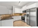 Modern kitchen featuring stainless steel appliances and granite countertops at 805 Pleasant Hill Rd # 171, Lilburn, GA 30047