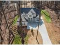 Shot highlighting manicured lawn, beautiful landscape, and ample driveway parking at 255 Olde Oak Dr, Jonesboro, GA 30238