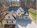 Beautiful two-story home with a modern design and a spacious concrete driveway at 255 Olde Oak Dr, Jonesboro, GA 30238