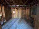 Unfinished basement featuring concrete floors and exposed wall studs at 424 Independence Dr, Jonesboro, GA 30238