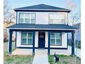 Charming two-story home featuring a covered porch and white and dark blue trim at 445 Griffin St, Atlanta, GA 30318