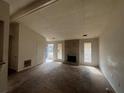 Inviting living room featuring a brick fireplace and lots of natural light at 5676 Marbut Rd, Lithonia, GA 30058